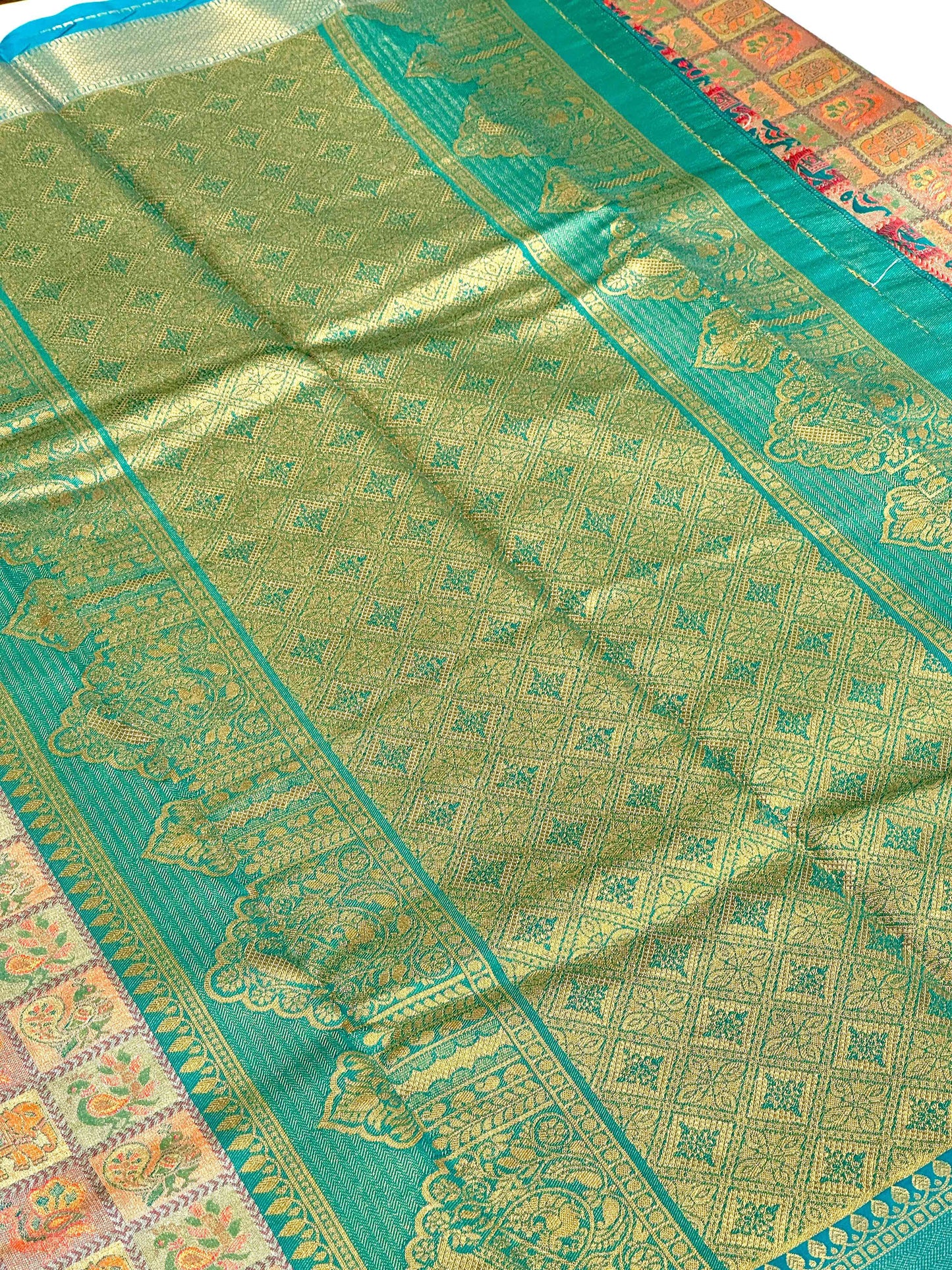 Sky Blue Animal Motif Saree With Gold Zari Border by My Store