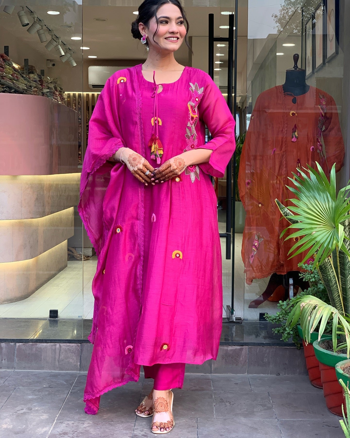 Vibrant Pink Embroidered Kurta Set with Playful Tassel Detailing