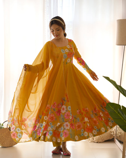 Woman wearing a yellow floral dress in a bright room.