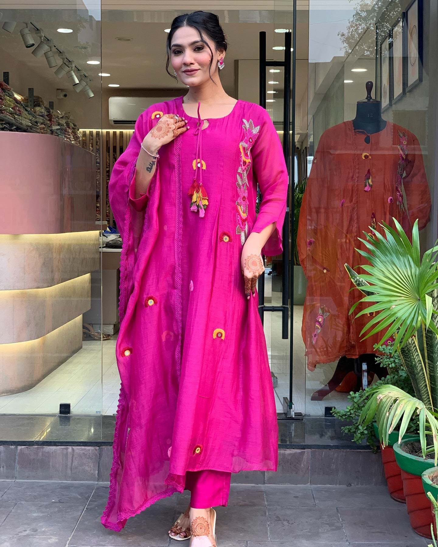 Vibrant Pink Embroidered Kurta Set with Playful Tassel Detailing