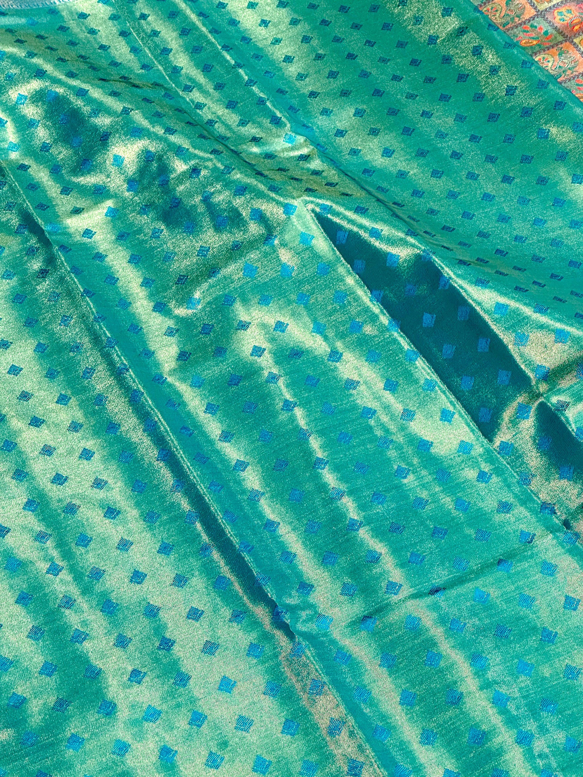 Sky Blue Animal Motif Saree With Gold Zari Border by My Store